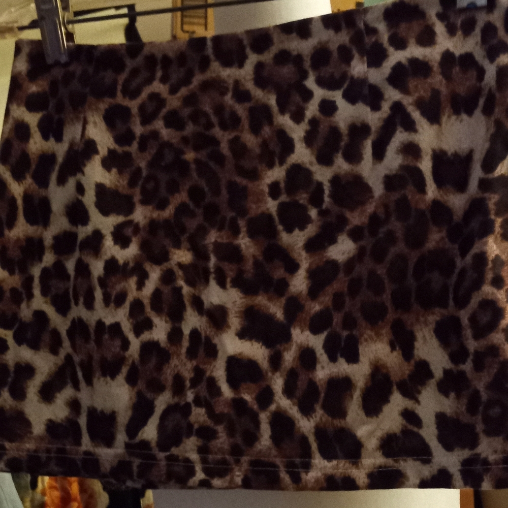 New,leopard print stretch mini skirt,side zipper, with self lined pantie size s.